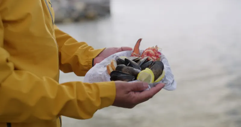 Freshly steamed Newfoundland mussels and lobster claw by the bay