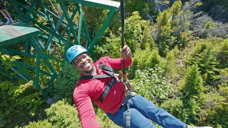 Ziplining high above the Steady Brook forest gorge at Marble Mountain